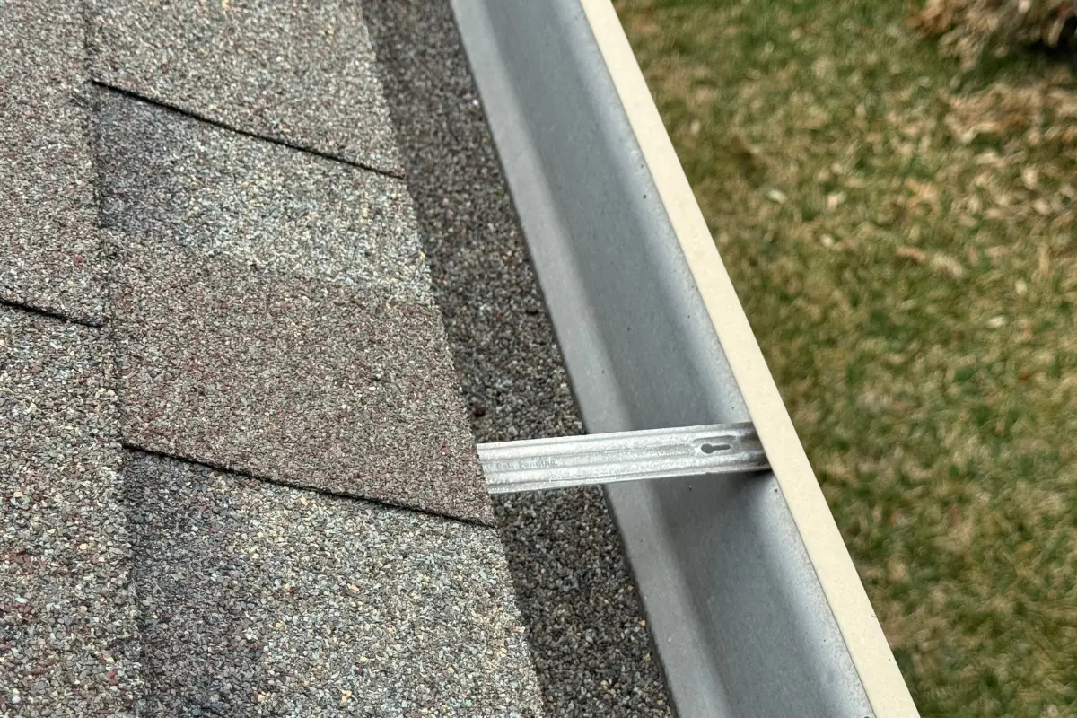 Excessive granule loss collected in gutters from inefficient attic ventilation