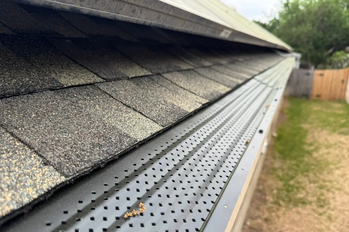New seamless aluminum gutters with leaf screen in Helotes, TX