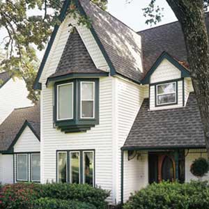Front view of a typical mid-class home with white Alside siding on it