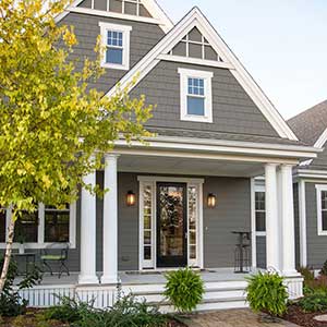 Front view of a typical mid-class home with gray James Hardie siding