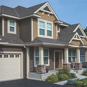 Front view of a typical mid-class home with brown LP SmartSide siding on it