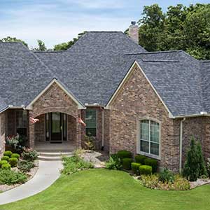 Front view of a typical mid-class home with Malarkey shingles on its roof