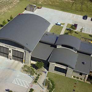 Top view of a firefighter station with a gray McElroy roof on it